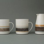 decorated mugs and pourer