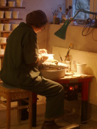 Tilla Waters decorating a teapot