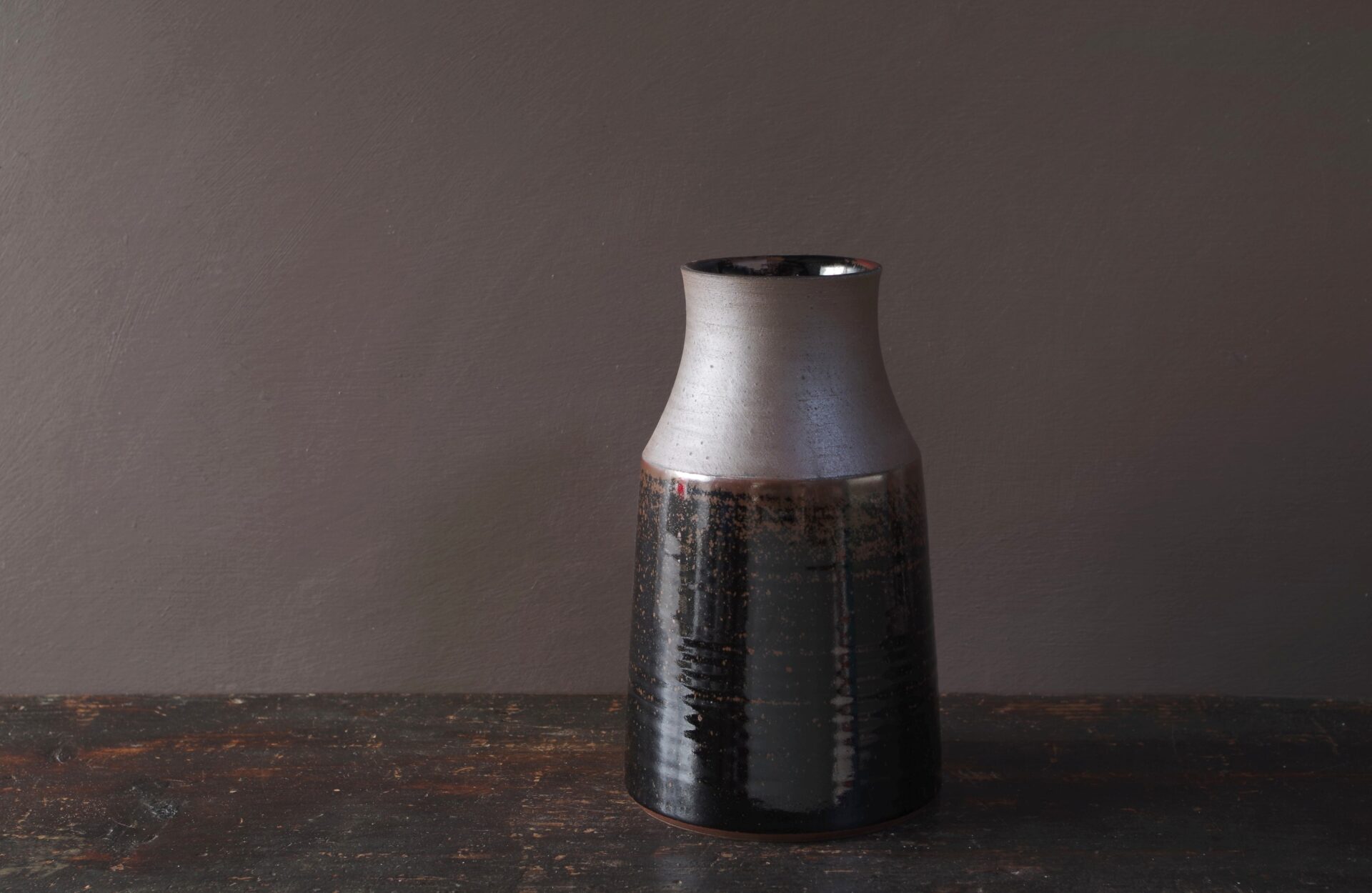 thrown stoneware carafe or vase with tenmoku glaze by James and Tilla Waters in Wales, UK