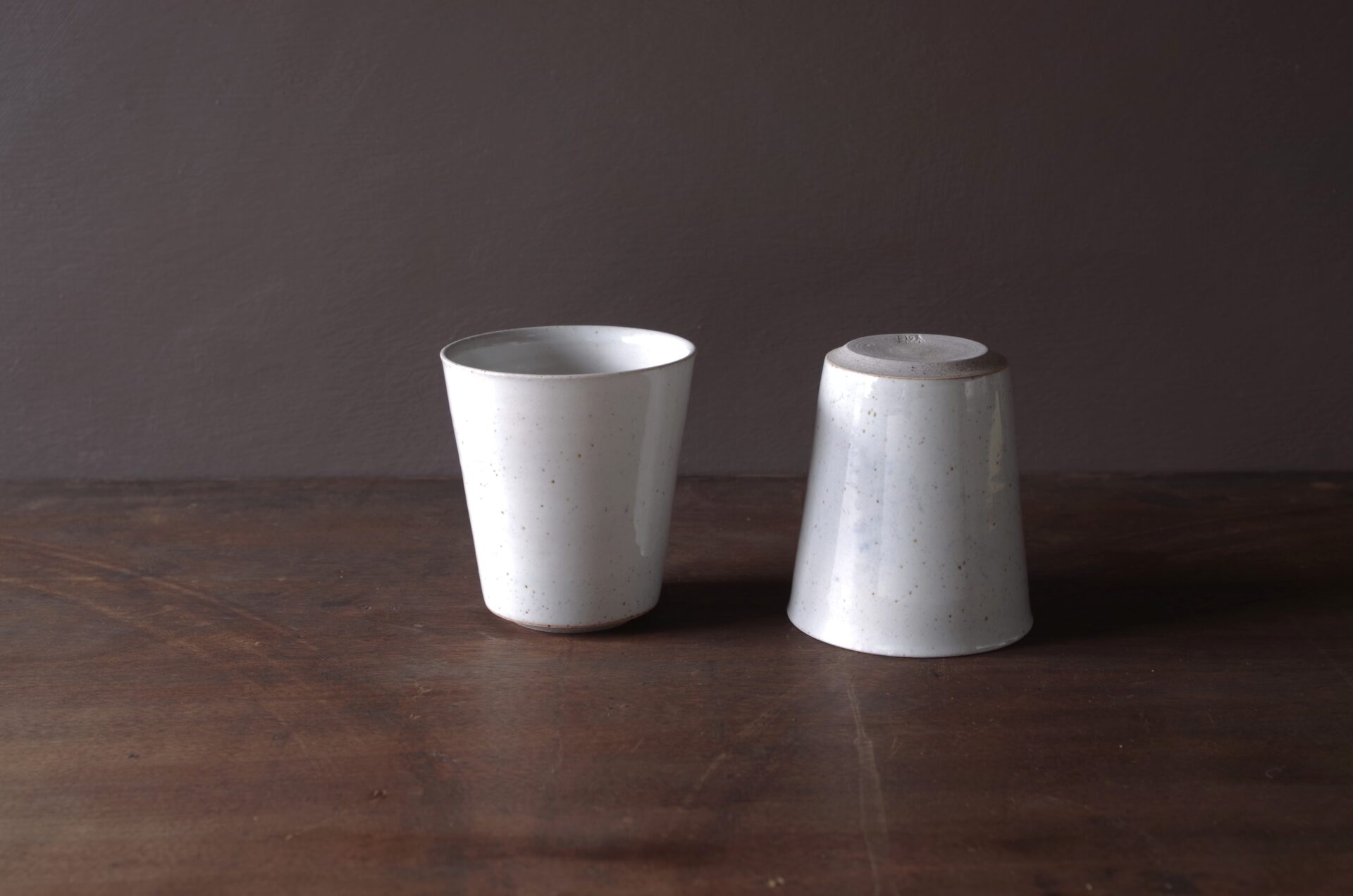 wheel thrown reduction fired stoneware beaker with off-white glaze by award winning potters James and Tilla Waters in Carmarthenshire, Wales, UK