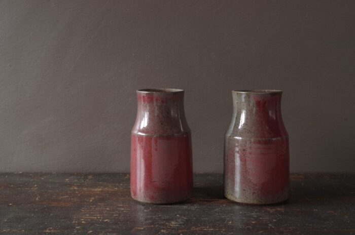 wheel thrown dark stoneware vase with copper red glaze reduction fired by award winning potters James and Tilla Waters in Carmarthenshire, Wales, UK