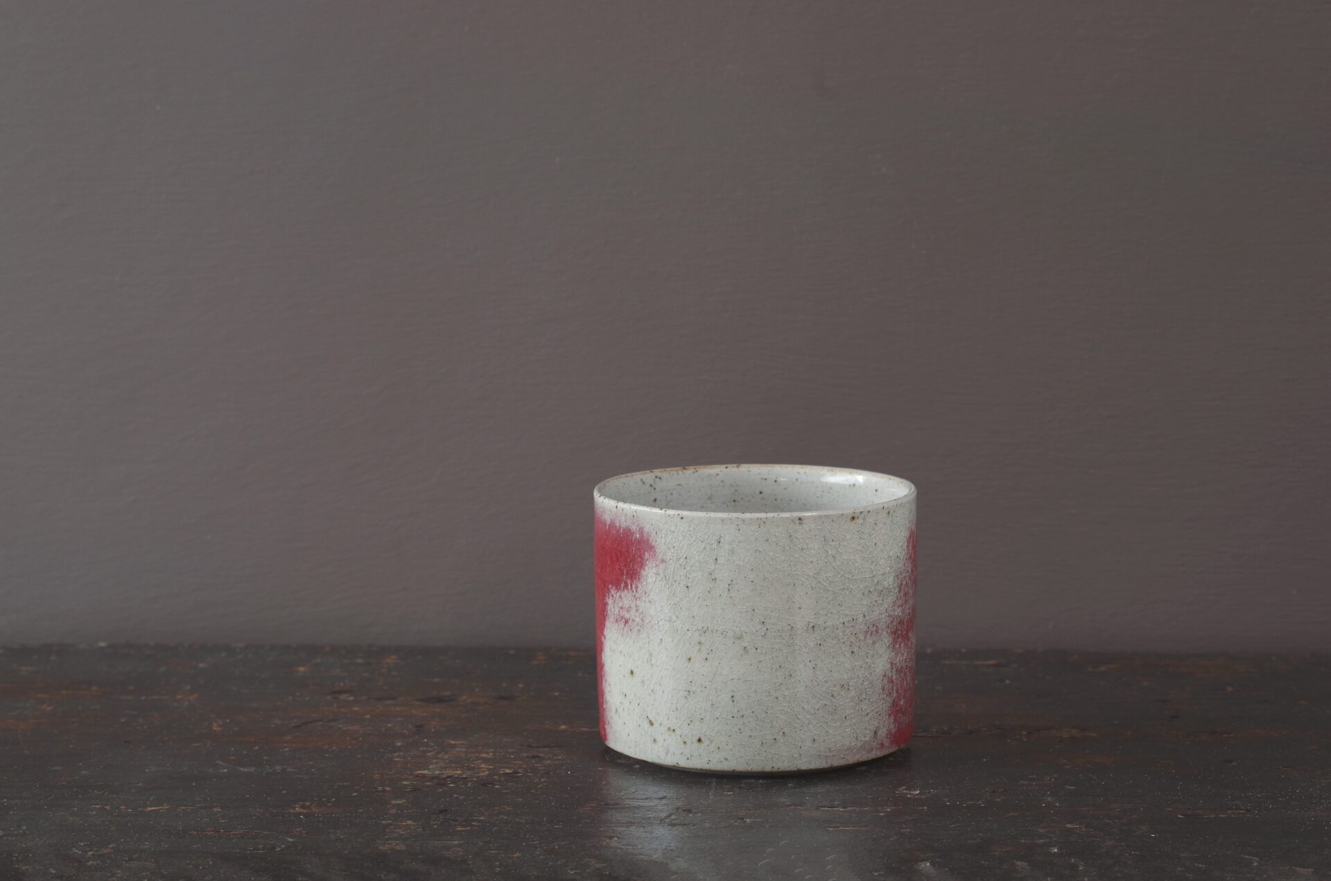 Wheel thrown stoneware breakfast mug with copper red glaze by award winning potters James and Tilla Waters in Carmarthenshire, Wales, UK