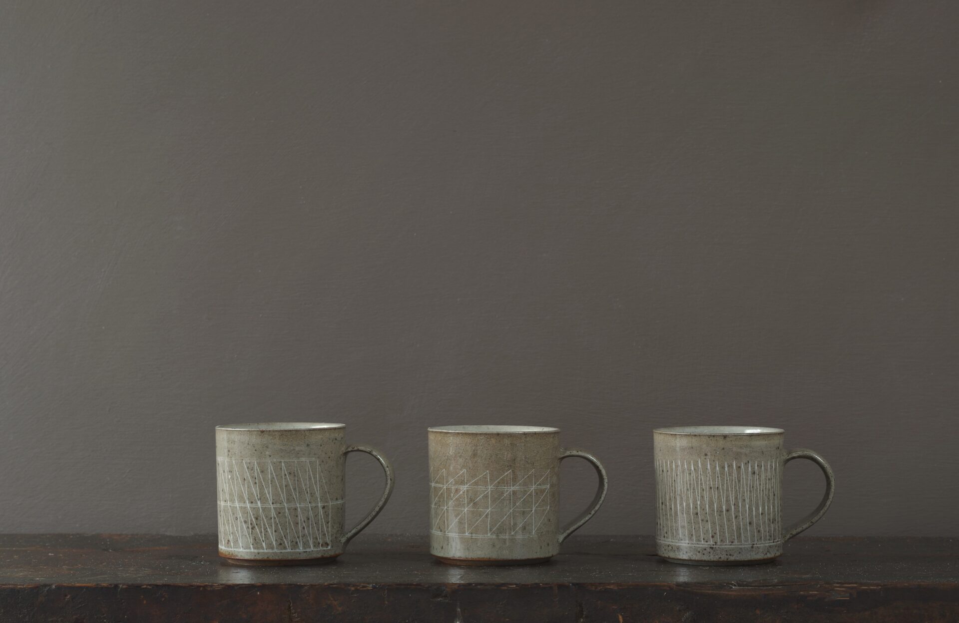 reduction fired stoneware mug (8cm x 8cm) with inlaid geometric decoration and pulled handle by award winning potters James and Tilla Waters in Carmartheshire, Wales, UK