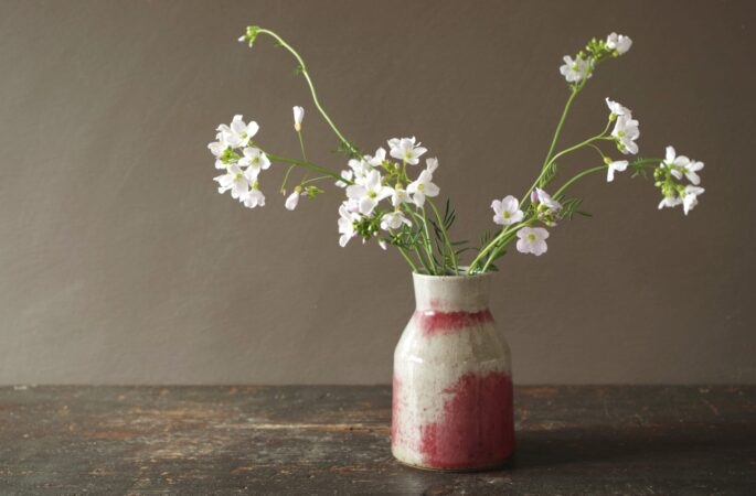 Reduction fired stoneware vase with patchy copper red glaze by award winning studio potters James and Tilla Waters in Carmarthenshire, Wales, UK