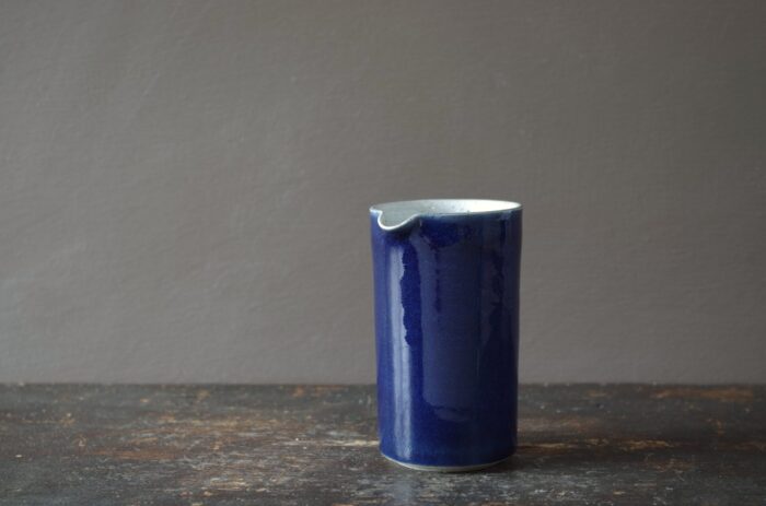 Reduction fired, wheel thrown, stoneware small pourer with cobalt blue glaze by award winning studio potters James and Tilla Waters in Carmarthenshire, Wales, UK