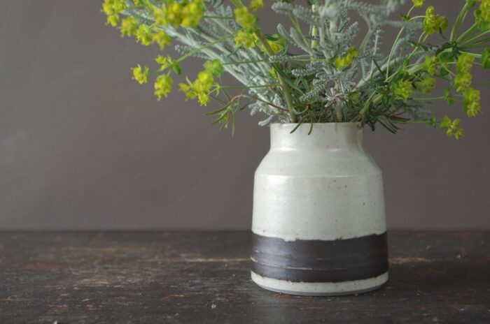 Reduction fired raw glazed stoneware vase with black band by award winning studio potters James and Tilla Waters in Carmarthenshire, Wales, UK