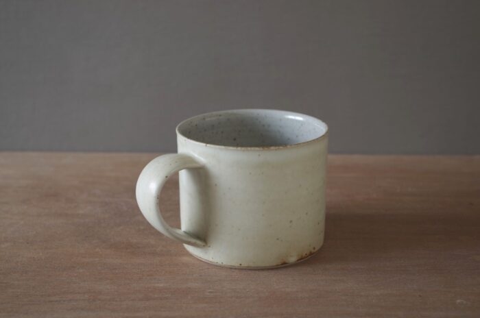 wheel thrown, reduction fired stoneware mug with satin ivory glaze, pulled handle by award winning studio potters James and Tilla Waters in Carmarthenshire, Wales, UK