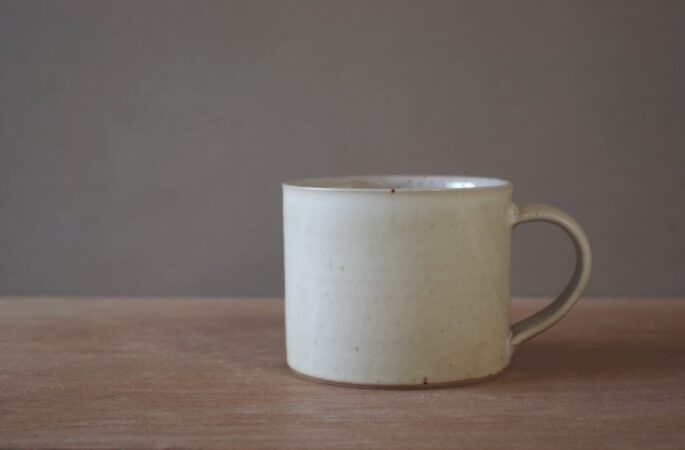 wheel thrown, reduction fired stoneware mug with satin ivory glaze, pulled handle by award winning studio potters James and Tilla Waters in Carmarthenshire, Wales, UK