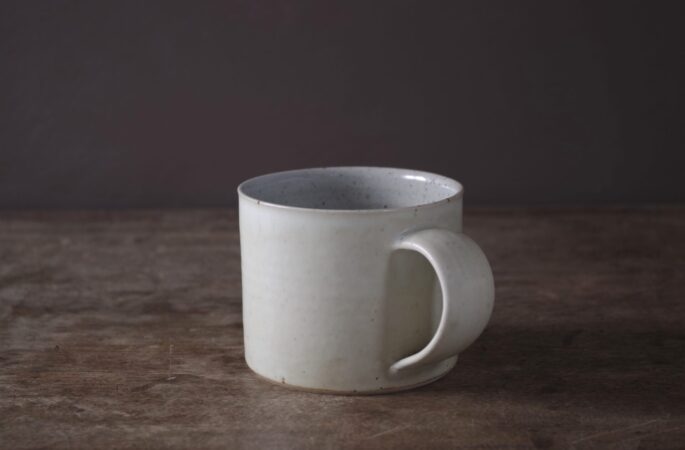 wheel thrown, reduction fired stoneware mug with satin not yellow glaze, pulled handle by award winning studio potters James and Tilla Waters in Carmarthenshire, Wales, UK