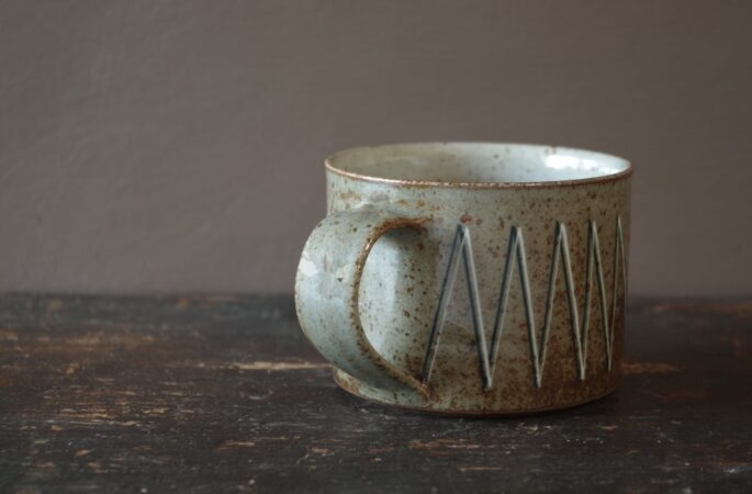 wheel thrown stoneware breakfast with inlaid geometric decoration and pulled handle by award winning potters James and Tilla Waters in Carmartheshire, Wales, UK
