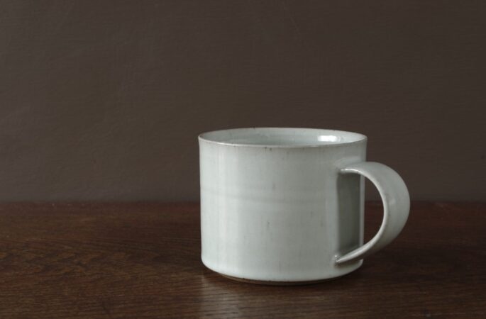 Wheel thrown reduction fired stoneware large breakfast mug with off-white glaze by award winning potters James and Tilla Waters in Carmarthenshire, Wales, UK