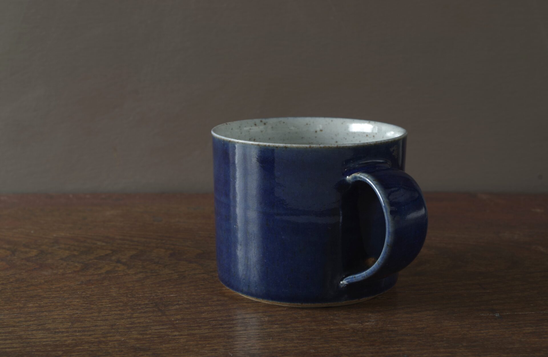 reduction fired stoneware large breakfast mug with dark blue glaze by award winning potters James and Tilla Waters in Carmarthenshire, Wales, UK