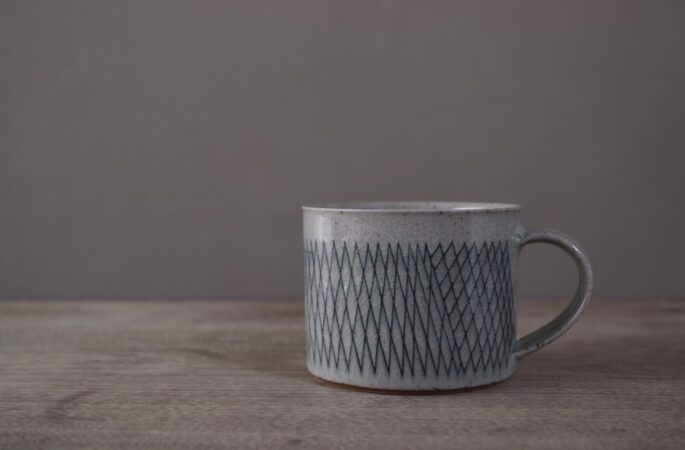 reduction fired stoneware breakfast mug with inlaid abstract decoration and pulled handle by award winning potters James and Tilla Waters in Carmartheshire, Wales, UK