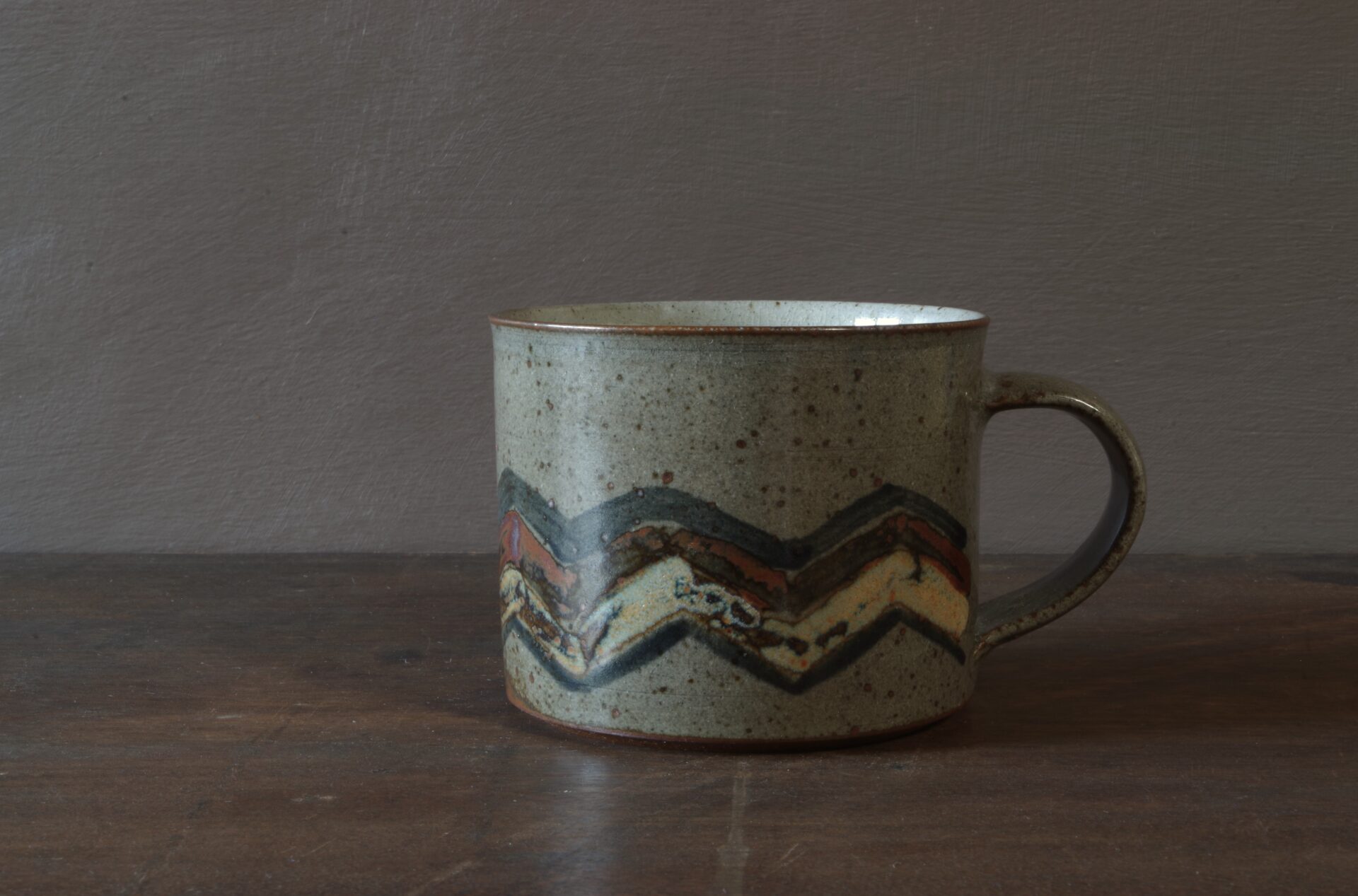 Reduction fired, wheel thrown, stoneware breakfast mug with pulled handle and hand decorated by award winning studio potters James and Tilla Waters in Carmarthenshire, Wales, UK