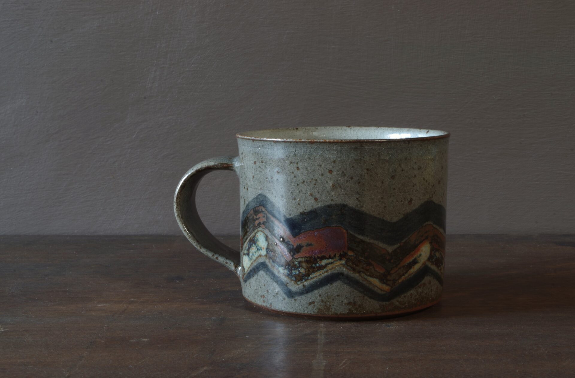 Reduction fired, wheel thrown, stoneware breakfast mug with pulled handle and hand decorated by award winning studio potters James and Tilla Waters in Carmarthenshire, Wales, UK