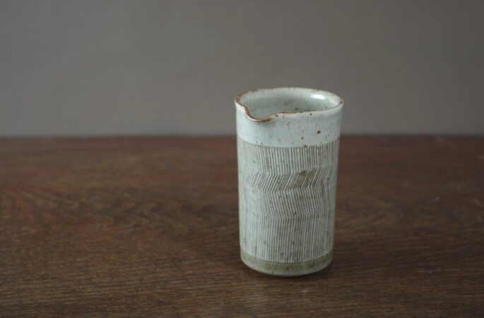 reduction fired, thrown stoneware small pourer with sgraffito decoration by award winning potters James and Tilla Waters in Carmarthenshire, Wales, UK