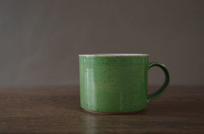 reduction fired stoneware large breakfast mug with green glaze by award winning potters James and Tilla Waters in Carmarthenshire, Wales, UK