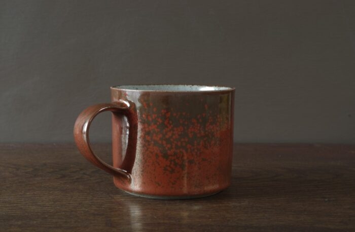 reduction fired stoneware large breakfast mug with persimmon glaze by award winning potters James and Tilla Waters in Carmarthenshire, Wales, UK