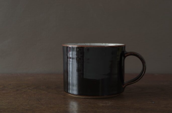 reduction fired stoneware large breakfast mug with tenmoku glaze by award winning potters James and Tilla Waters in Carmarthenshire, Wales, UK