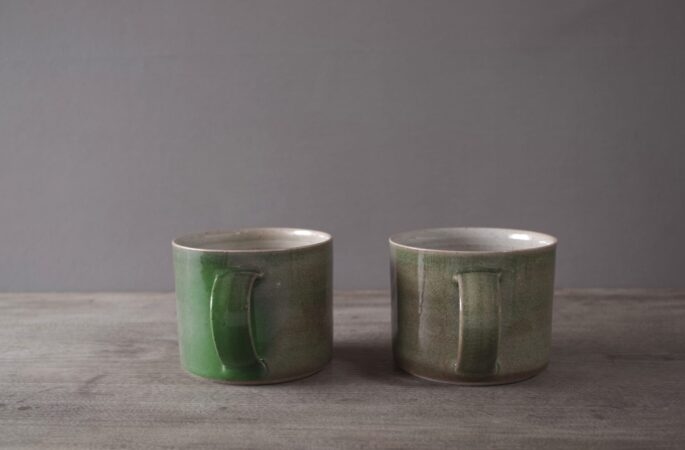 reduction fired stoneware large breakfast mug with variable green glaze by award winning potters James and Tilla Waters in Carmarthenshire, Wales, UK