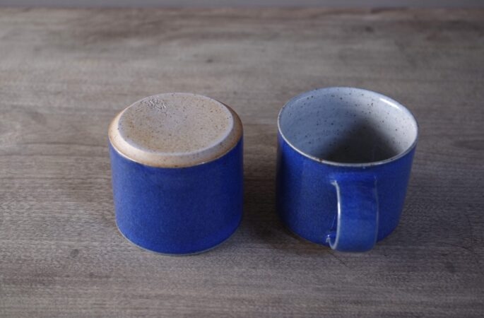 Wheel thrown stoneware coffee cup with cobalt blue glaze by award winning potters James and Tilla Waters in Carmarthenshire, Wales, UK