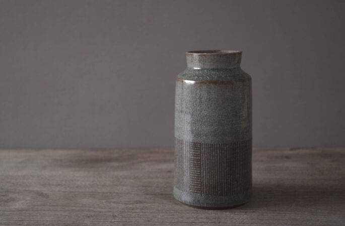 reduction fired thrown stoneware vase with inlaid decoration and neutral clear glaze by award winning potters James and Tilla Waters in their pottery in Carmarthenshire, Wales