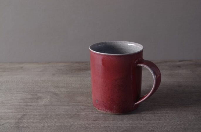 wheel thrown, reduction fired stoneware large mug with copper red glaze by award winning potters James and Tilla Waters in Carmarthenshire, Wales, UK