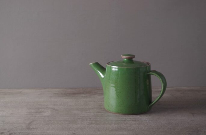 wheel thrown, reduction fired stoneware teapot with pulled handle and green glaze by award winning potters James and Tilla Waters in Carmarthenshire, Wales, UK