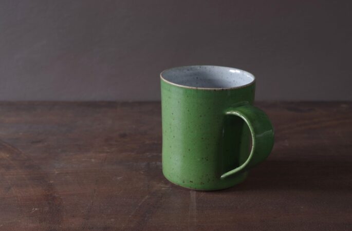 large reduction fired stoneware mug with green glaze by award winning potters James and Tilla Waters in Carmarthenshire, Wales, UK