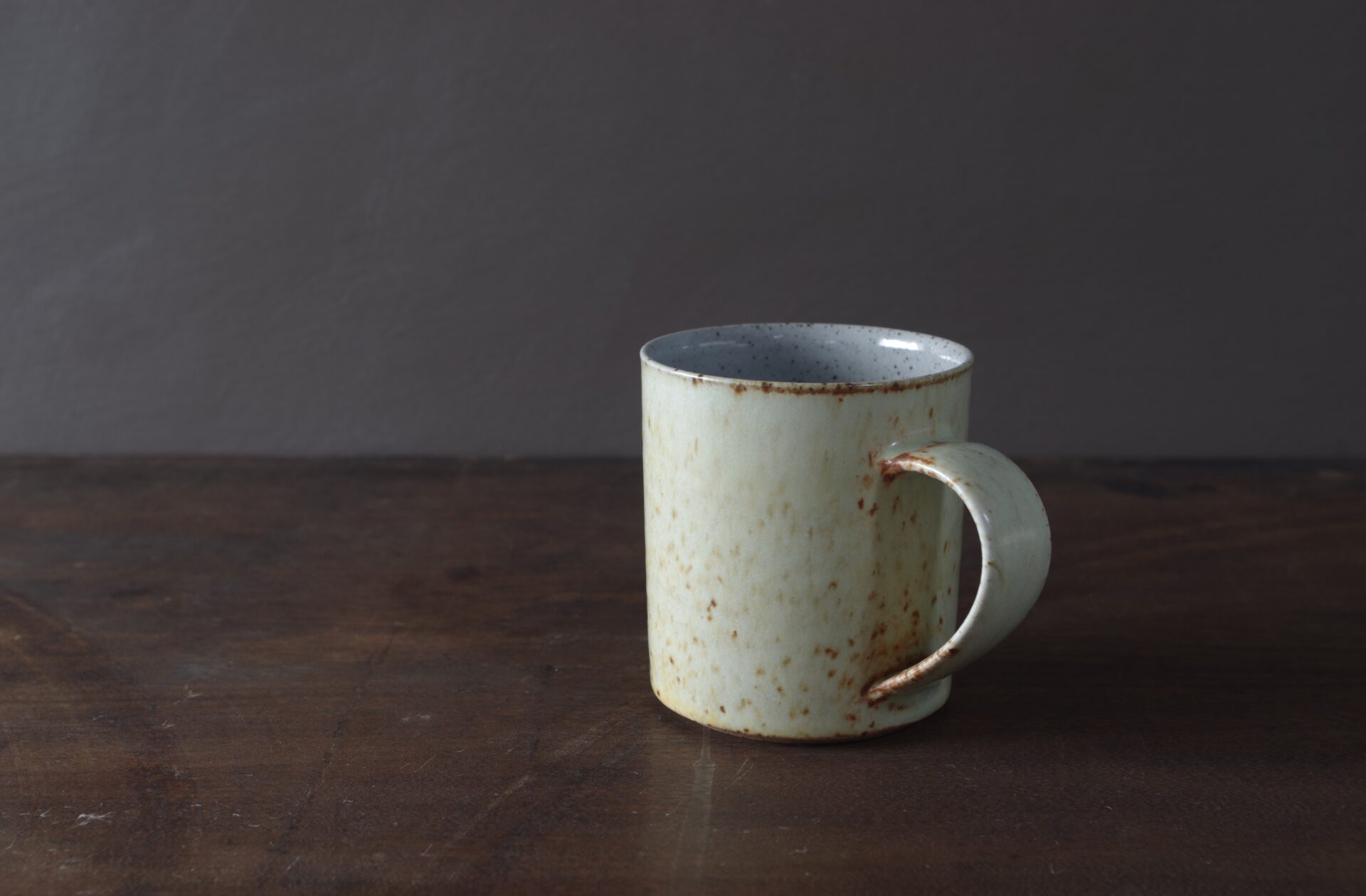 small reduction fired stoneware mug with not yellow glaze by award winning potters James and Tilla Waters in Carmarthenshire, Wales, UK