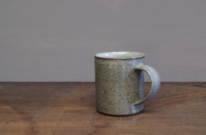 Thrown stoneware reduction fired mug with clear (grey) glaze by award winning potters James and Tilla Waters in Carmarthenshire, Wales, UK