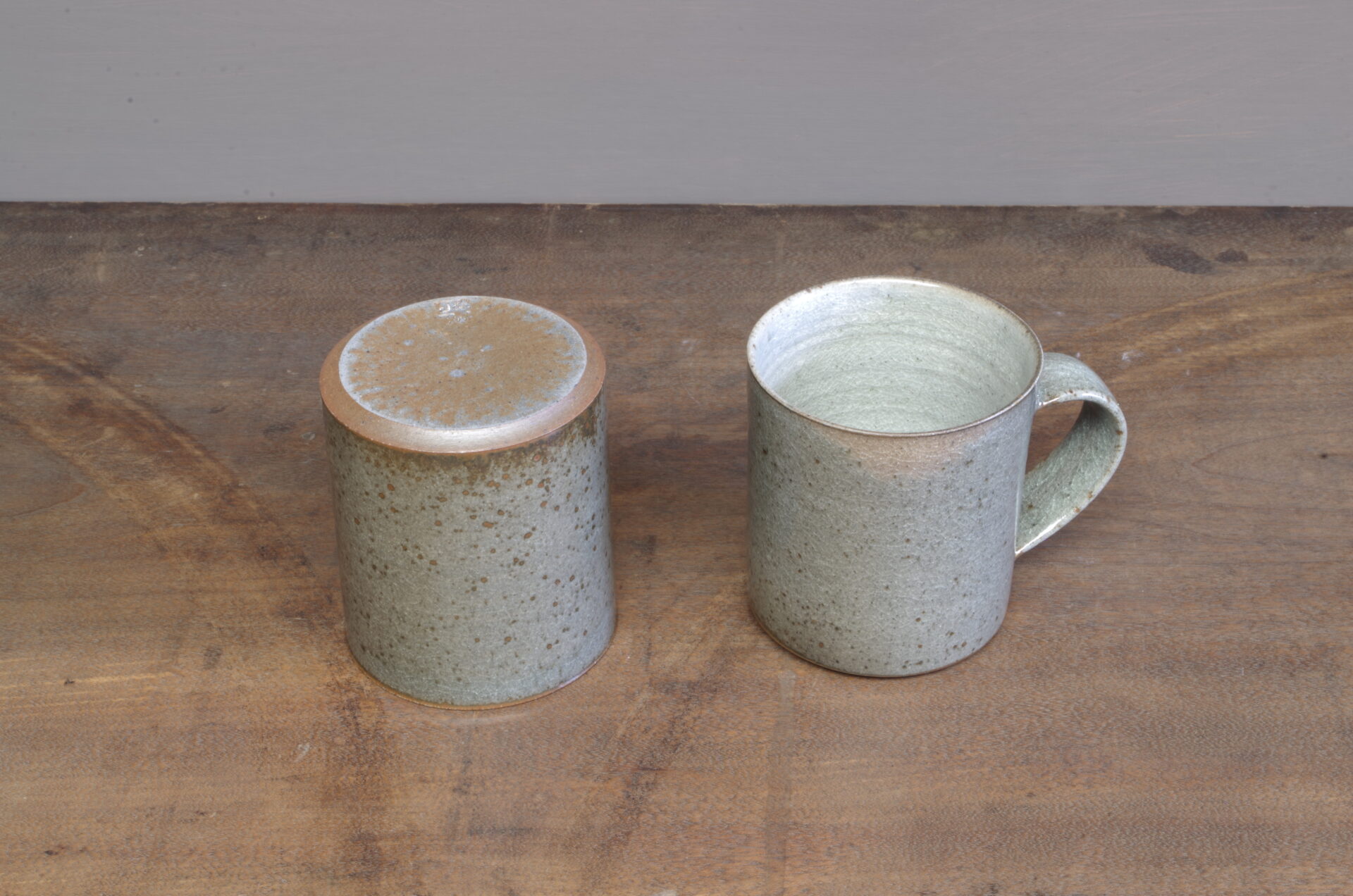 Thrown stoneware reduction fired mug with clear (grey) glaze by award winning potters James and Tilla Waters in Carmarthenshire, Wales, UK