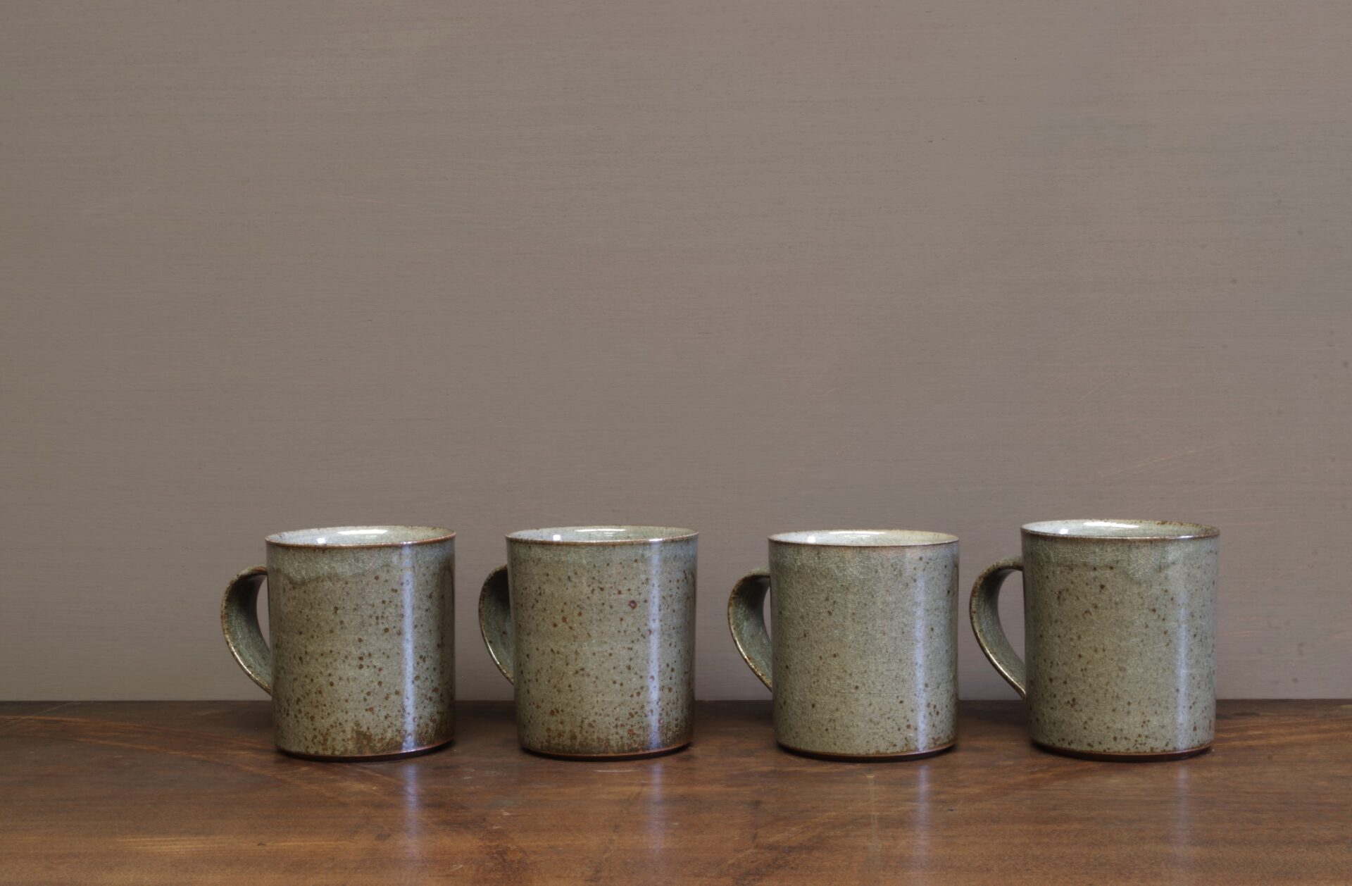 Thrown stoneware reduction fired mug with clear (grey) glaze by award winning potters James and Tilla Waters in Carmarthenshire, Wales, UK
