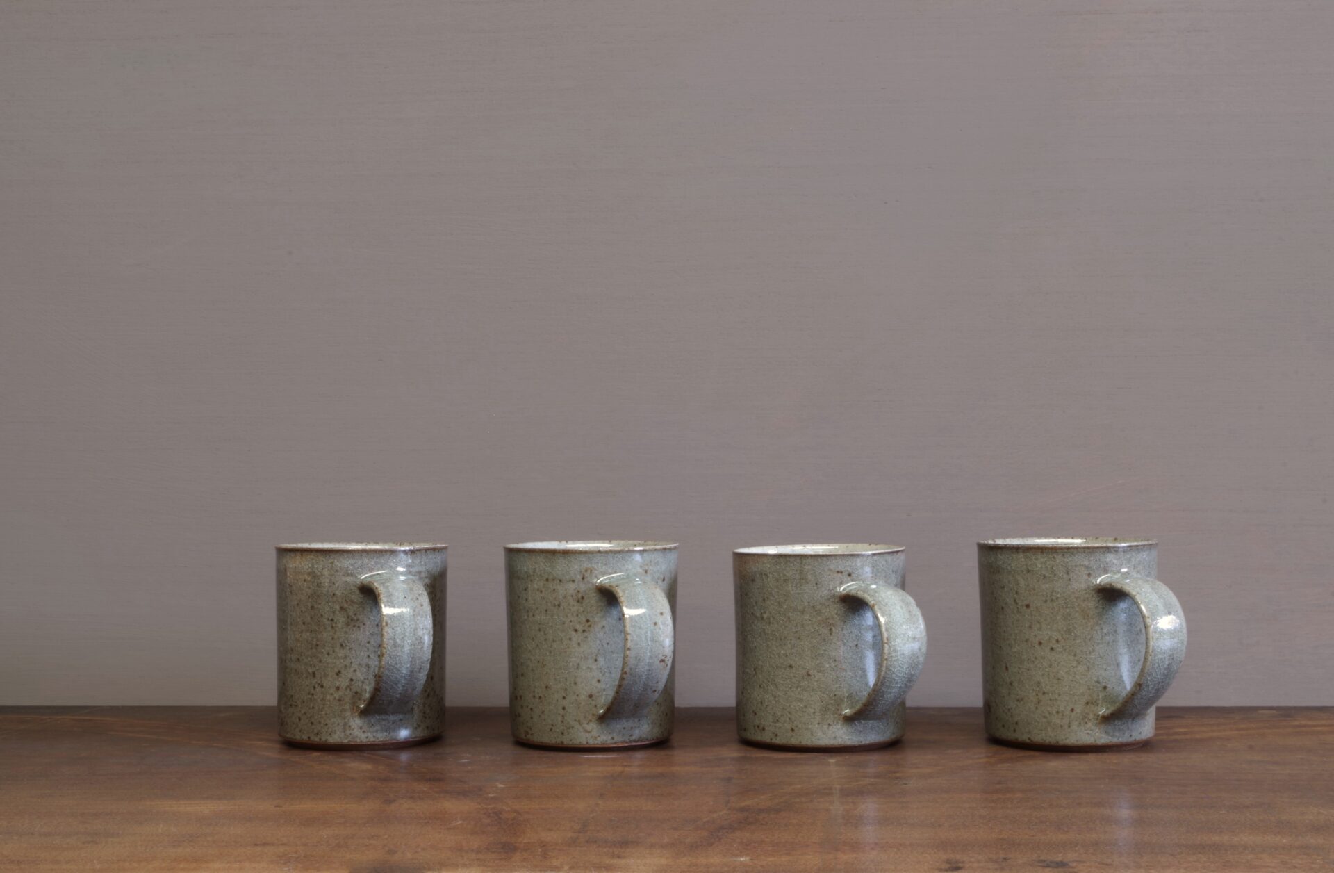 Thrown stoneware reduction fired mug with clear (grey) glaze by award winning potters James and Tilla Waters in Carmarthenshire, Wales, UK