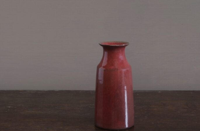 wheel thrown dark stoneware vase with copper red glaze, reduction fired by award winning potters James and Tilla Waters in Carmarthenshire, Wales, UK