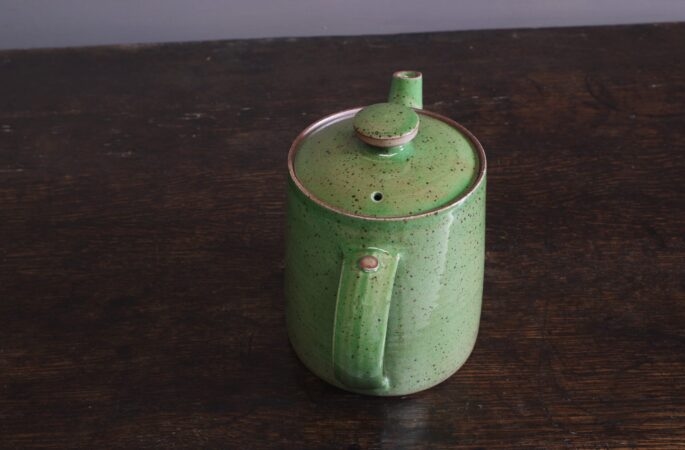 wheel thrown, reduction fired stoneware teapot with pulled handle and green glaze by award winning potters James and Tilla Waters in Carmarthenshire, Wales, UK