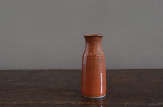 wheel thrown stoneware vase with persimmon glaze, reduction fired by award winning potters James and Tilla Waters in Carmarthenshire, Wales, UK