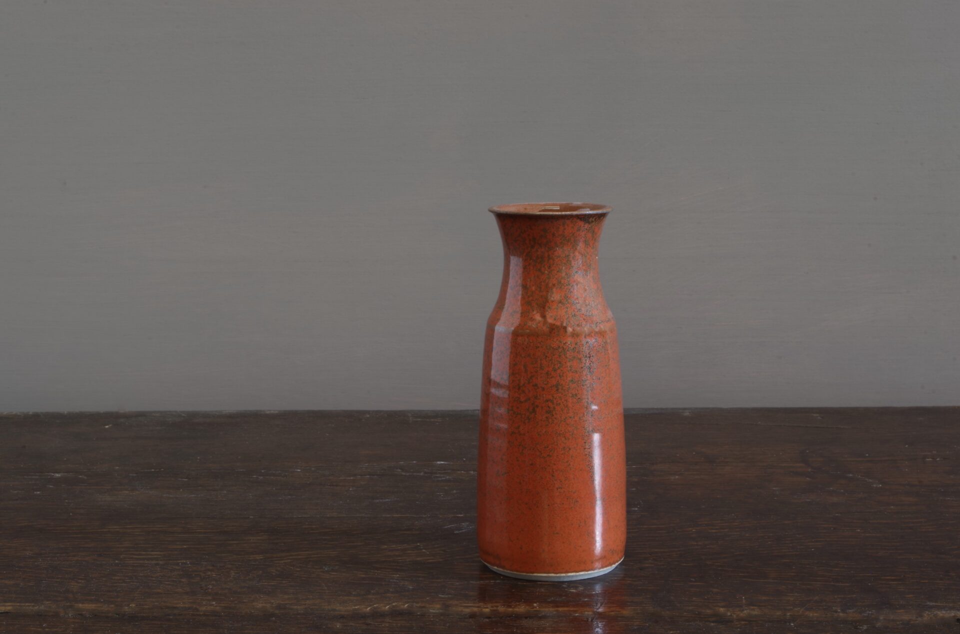 wheel thrown stoneware vase with persimmon glaze, reduction fired by award winning potters James and Tilla Waters in Carmarthenshire, Wales, UK