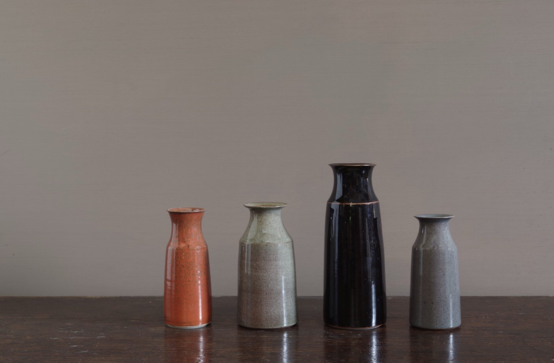 wheel thrown dark stoneware vase with tenmoku glaze, reduction fired by award winning potters James and Tilla Waters in Carmarthenshire, Wales, UK