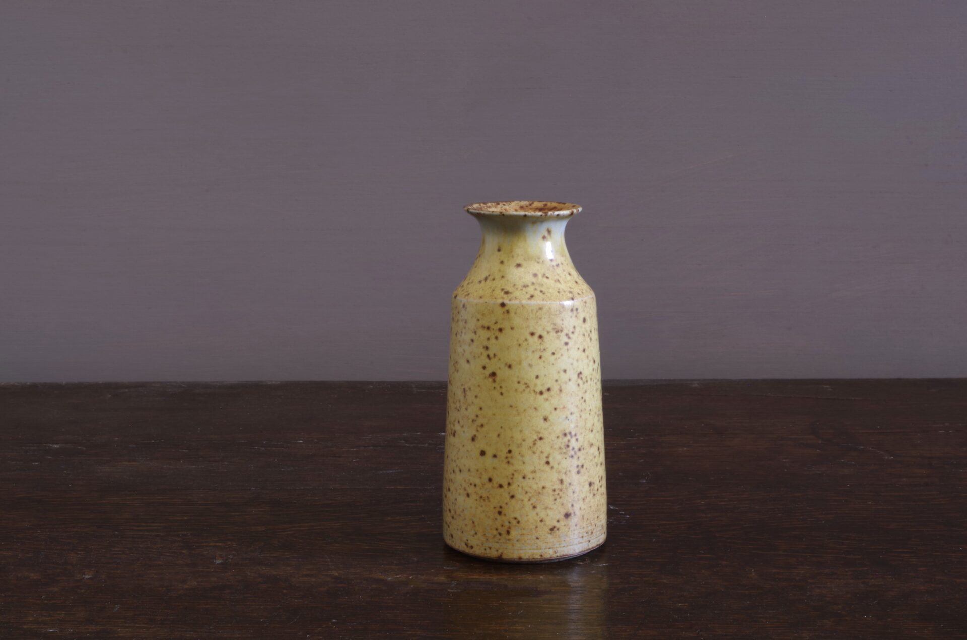 wheel thrown stoneware vase with yellow glaze, reduction fired by award winning potters James and Tilla Waters in Carmarthenshire, Wales, UK