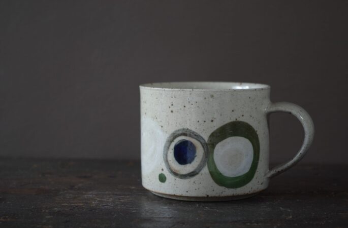 Reduction fired, wheel thrown, stoneware mug with pulled handle and hand decorated by award winning studio potters James and Tilla Waters in Carmarthenshire, Wales, UK