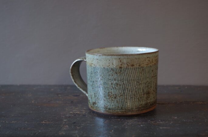 Reduction fired, wheel thrown, stoneware large breakfast mug with pulled handle and hand decorated with inlay by award winning studio potters James and Tilla Waters in Carmarthenshire, Wales, UK