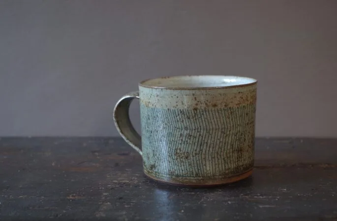 Reduction fired, wheel thrown, stoneware large breakfast mug with pulled handle and hand decorated with inlay by award winning studio potters James and Tilla Waters in Carmarthenshire, Wales, UK