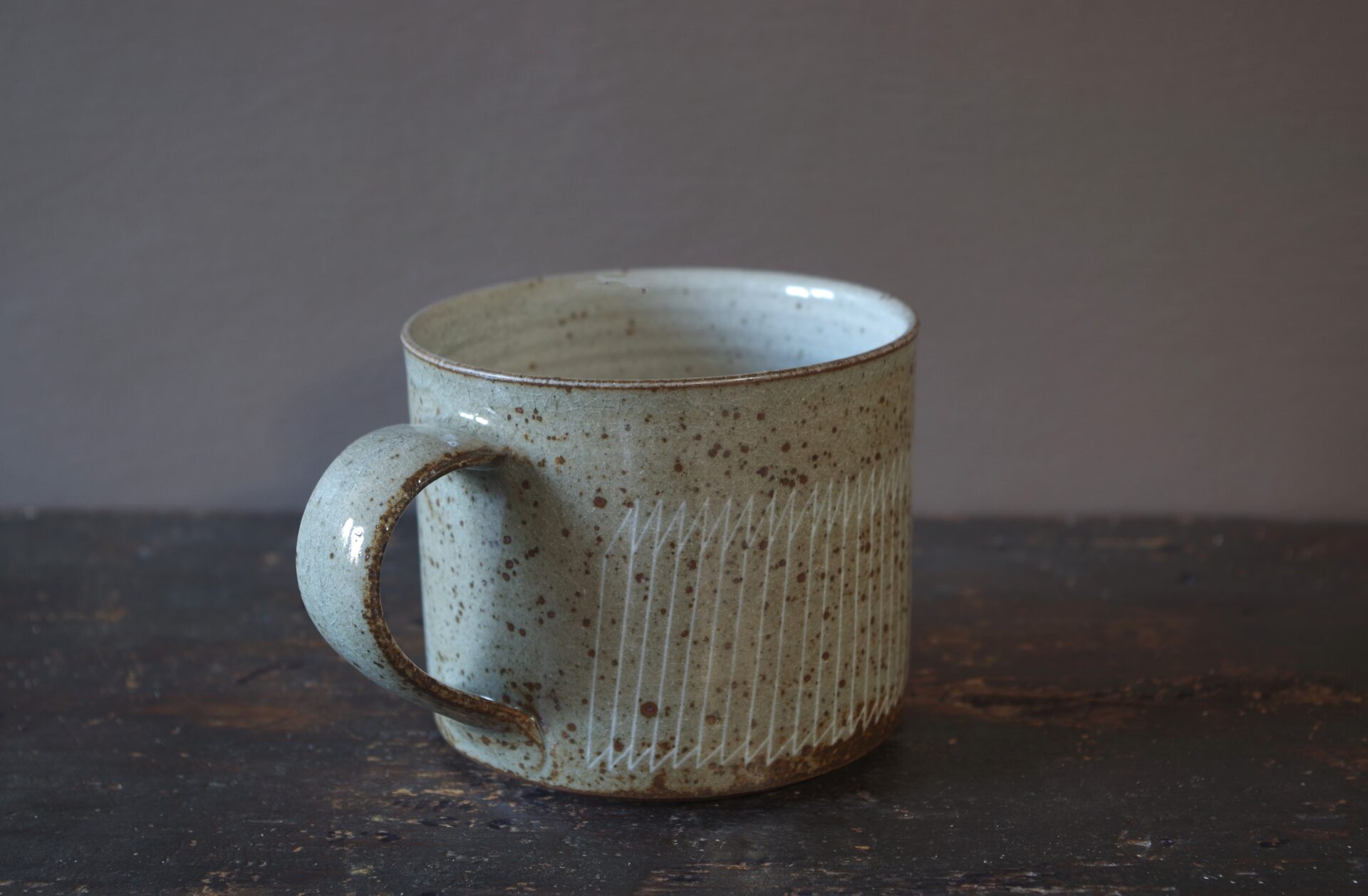 Reduction fired, wheel thrown, stoneware large breakfast mug with pulled handle and hand decorated with inlay by award winning studio potters James and Tilla Waters in Carmarthenshire, Wales, UK