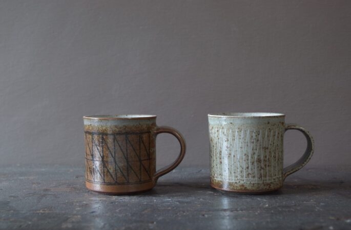 Reduction fired, wheel thrown, stoneware coffee cup with pulled handle and hand decorated with inlay by award winning studio potters James and Tilla Waters in Carmarthenshire, Wales, UK