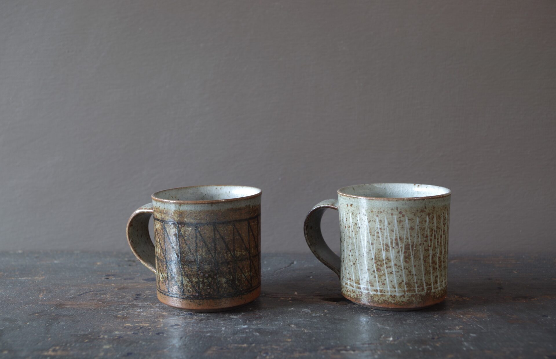 Reduction fired, wheel thrown, stoneware coffee cup with pulled handle and hand decorated with inlay by award winning studio potters James and Tilla Waters in Carmarthenshire, Wales, UK