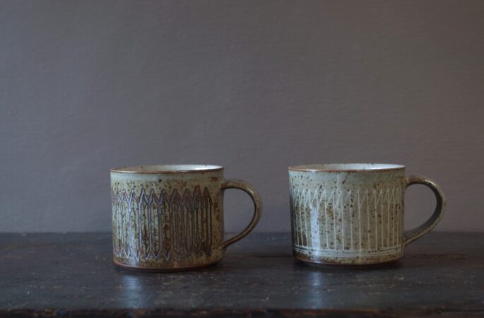 Reduction fired, wheel thrown, stoneware coffee cup with pulled handle and hand decorated with inlay by award winning studio potters James and Tilla Waters in Carmarthenshire, Wales, UK