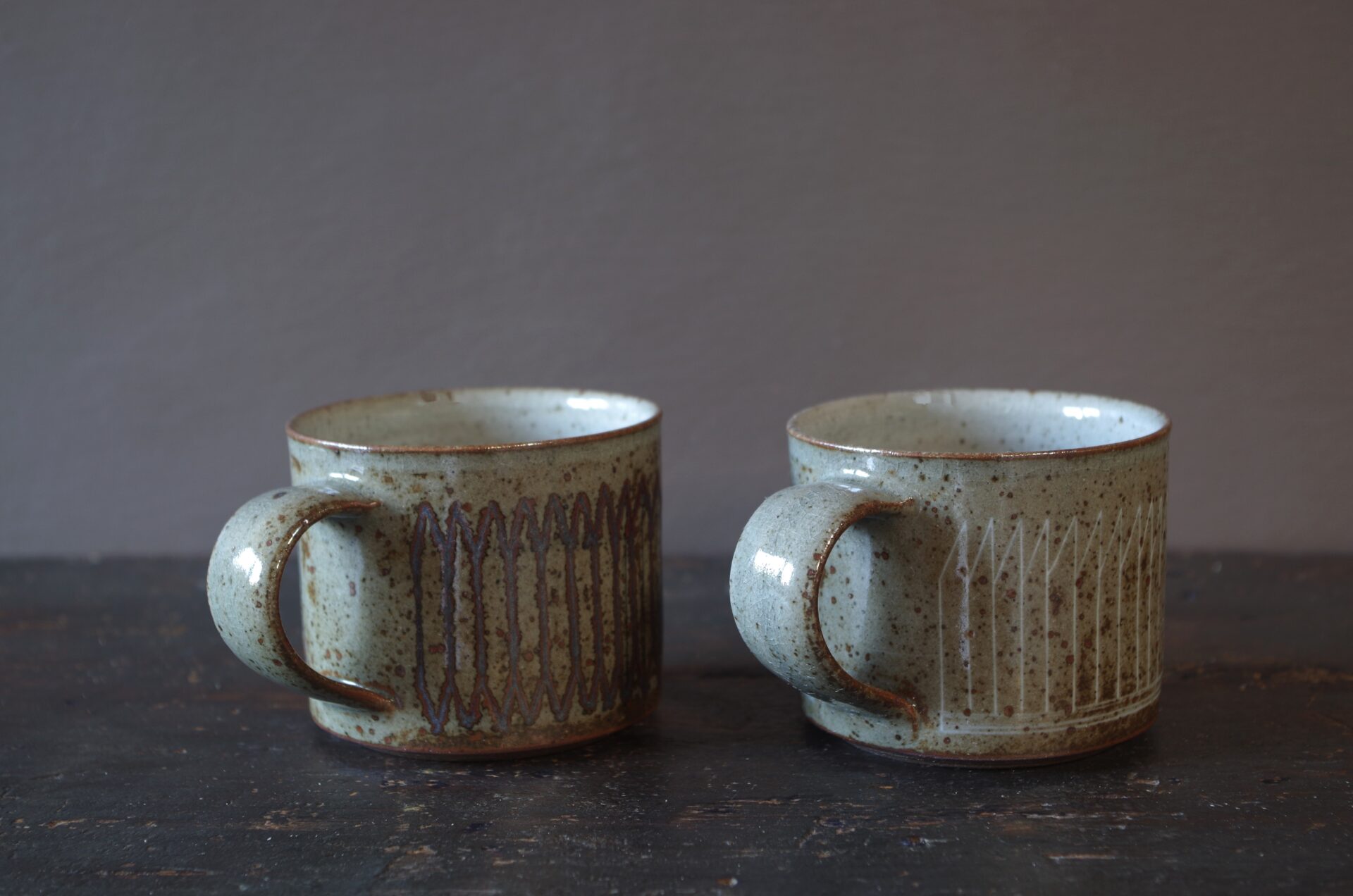 Reduction fired, wheel thrown, stoneware coffee can with pulled handle and hand decorated with inlay by award winning studio potters James and Tilla Waters in Carmarthenshire, Wales, UK