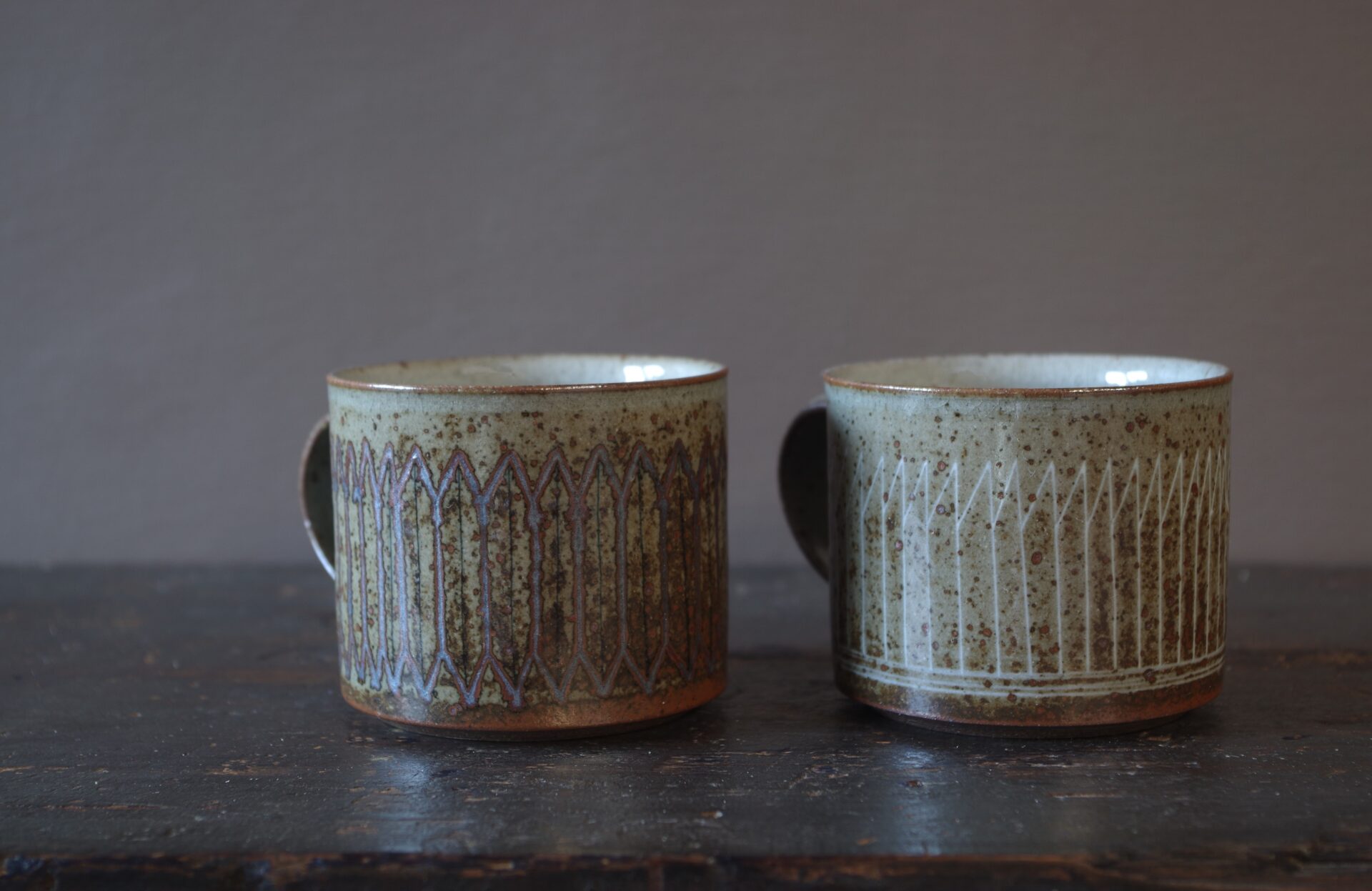 Reduction fired, wheel thrown, stoneware coffee can with pulled handle and hand decorated with inlay by award winning studio potters James and Tilla Waters in Carmarthenshire, Wales, UK