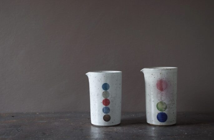 reduction fired, thrown stoneware small pourers with circle decoration by award winning potters James and Tilla Waters in Carmarthenshire, Wales, UK